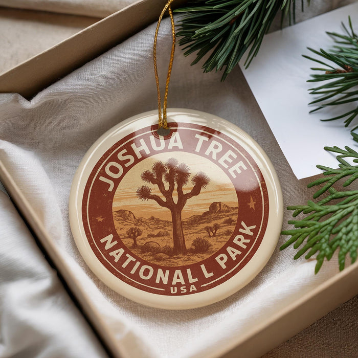 A circular ornament with the text "JOSUA TREE NATIONAL PARK USA" printed on it, hanging from a string.