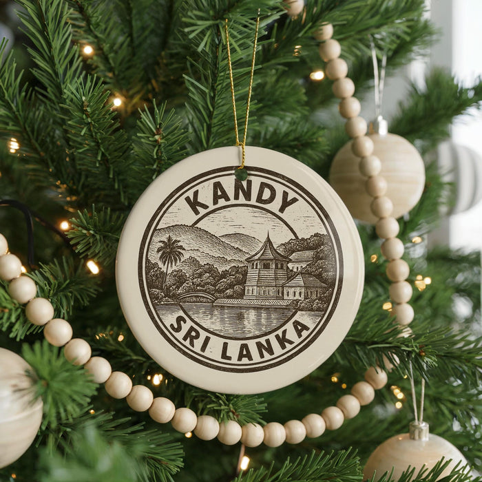 A Christmas tree decorated with ornaments, including a circular ornament with a design of a temple and mountains, surrounded by lights and greenery.