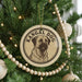 A circular ornament on a Christmas tree featuring a kangaroo dog, with the text "KANGAL DOG" printed on it.
