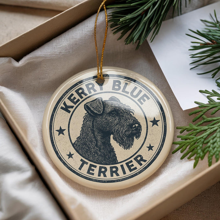 A circular ornament with a black and white illustration of a terrier dog, surrounded by stars, and the text "Kerr Blue Terrier" on it.