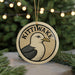 A circular ornament featuring a seagull with the text "KITTIWAKES" on it, hanging from a string.