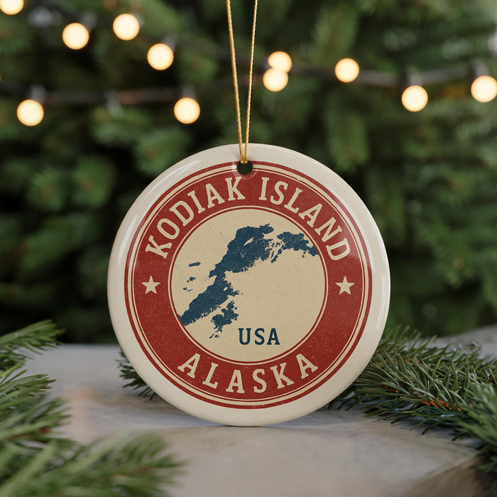 A circular ornament with the text "KODIAK ISLAND USA" and a map of Alaska, surrounded by Christmas lights and greenery.
