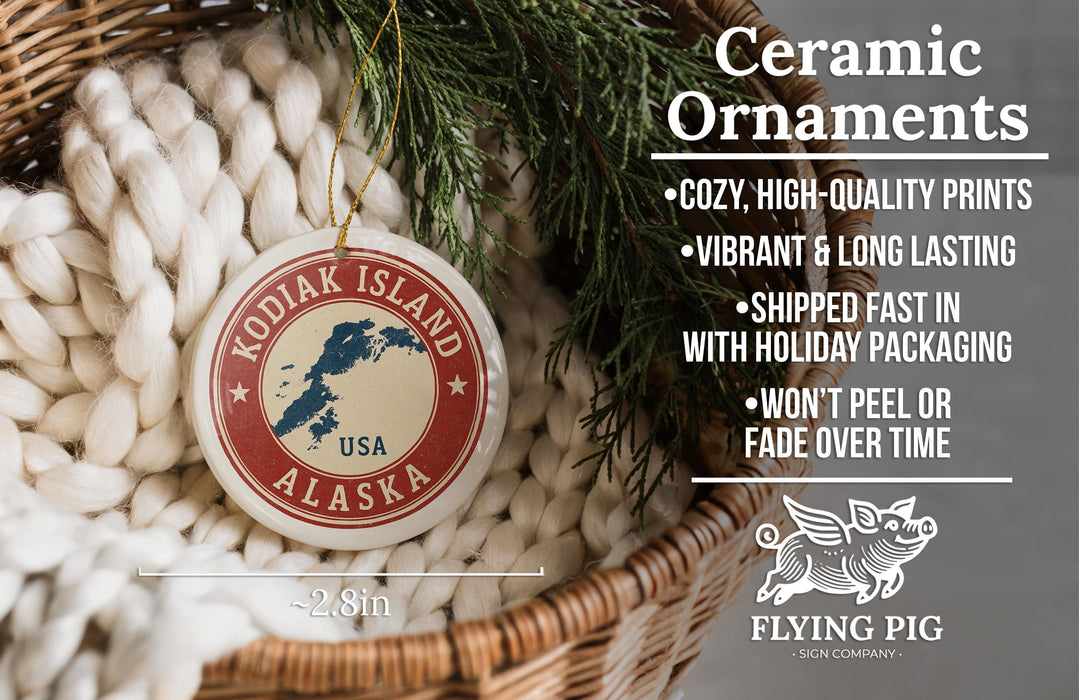 Ceramic ornaments, featuring a decorative design of Alaska on a red and white circular ornament, are displayed in a woven basket.