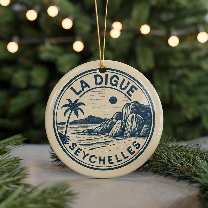 A circular ornament with the text "LA DIGUE SEYCHELLES" and a palm tree illustration, hanging from a string.
