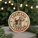 A circular ornament featuring a terrier dog, with the text "LAKELAND TERRIER" printed on it.