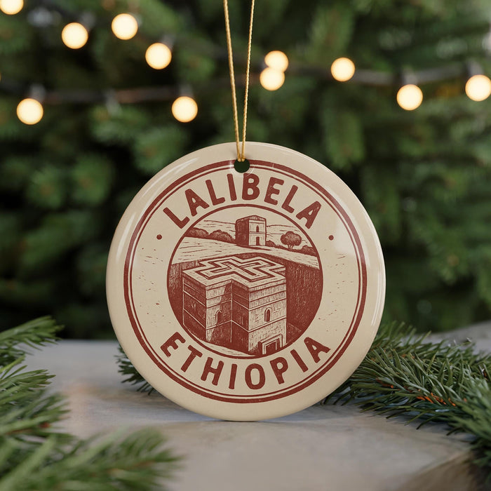 A circular ornament with the text "LALIBEZA" and "ETHIOPIA" printed on it, hanging from a string.