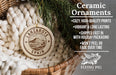 Ceramic ornaments, specifically a round ornament with the text "LANZAROTE SPAN" and a mountain design, hanging from a wicker basket.