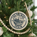 A circular ornament on a Christmas tree, featuring the text "LAS PALMAS" and "SPAIN" along with an illustration of a cityscape.