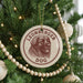 A Christmas tree decorated with ornaments, including a circular ornament with a dog's face and the text "LEONBERGER DOG" printed on it.