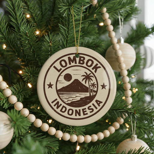 A Christmas tree decorated with ornaments, including a circular ornament with the text "LOMBOK INDONESIA" and a palm tree design.