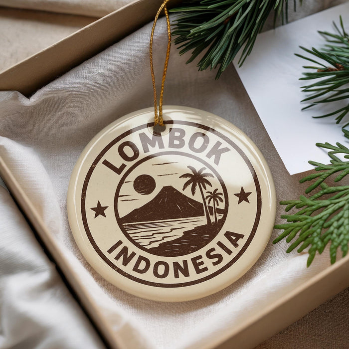 A circular ornament with the text "LOMBOK INDONESIA" printed on it, surrounded by a palm tree and a mountain landscape.