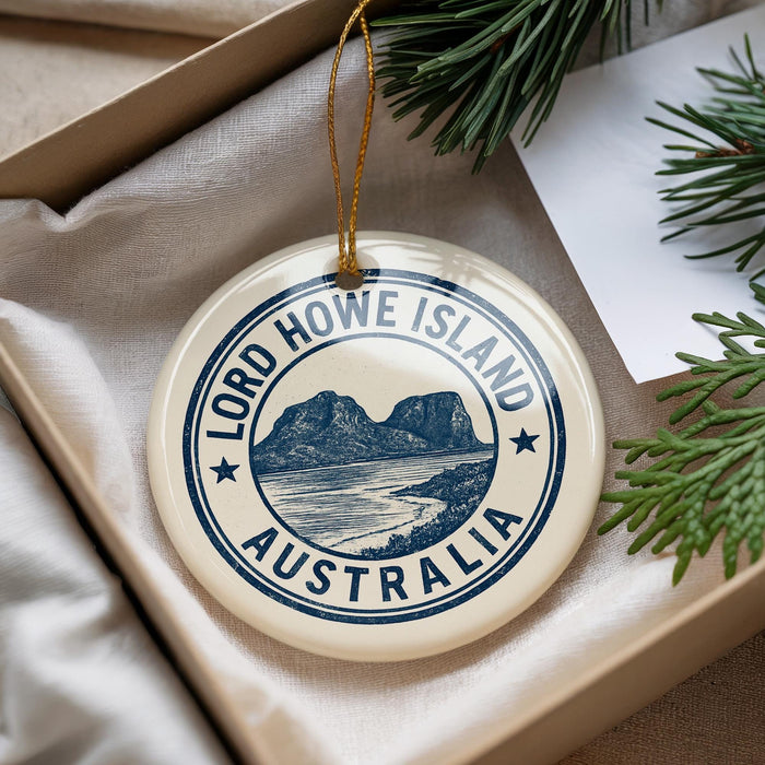 A circular ornament with the text "LORD HOWE ISLAND AUSTRALIA" printed on it, hanging from a string.