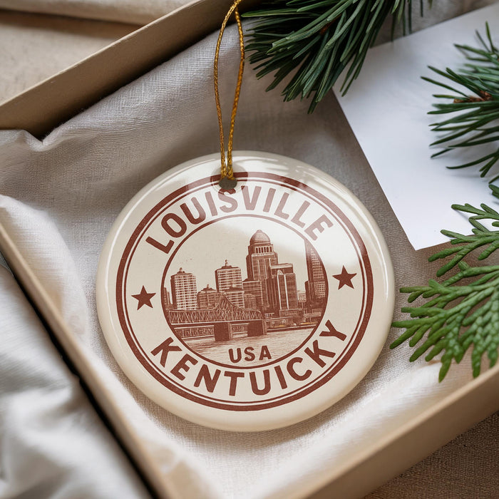 A circular ornament with the text "LOUISVILLE KENTUCKY" and an image of a city skyline, hanging from a string.