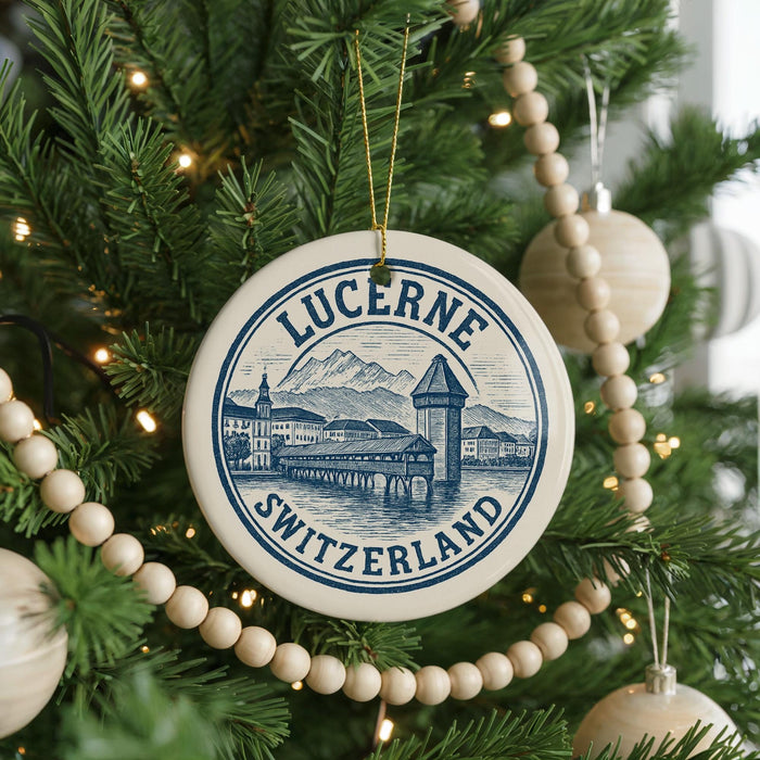 A Christmas tree decorated with ornaments, including a circular ornament with a picture of Lucerne, Switzerland, and a beaded ornament.