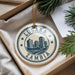 A circular ornament with the text "LUSAKA ZAMBIA" printed on it, surrounded by a decorative border and stars.