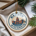 A circular ornament with the text "MADISON, WISCONSIN, USA" and an illustration of a city skyline.