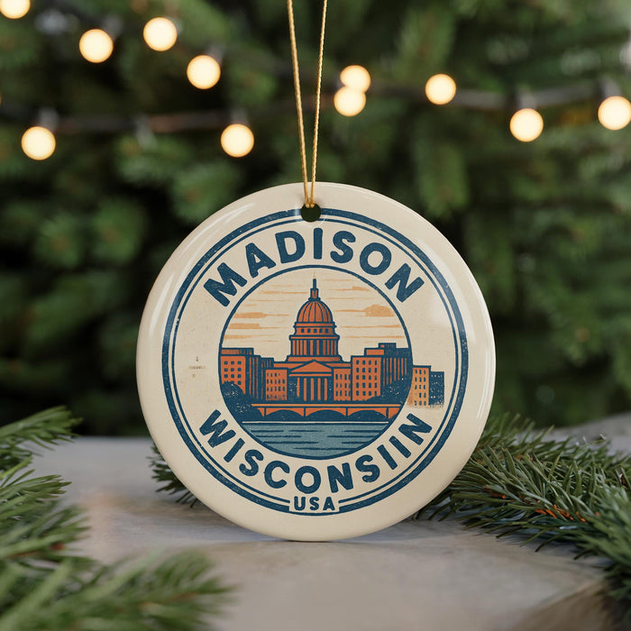 A circular ornament with the text "MADISON, WISCONSIN, USA" and an illustration of the Madison, Wisconsin skyline.