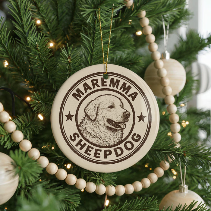 A Christmas tree decorated with ornaments, including a circular ornament with the text "Maremma Sheepdog" and a dog image.