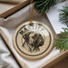 A round ornament with a dog's head and the word "Mastiff" printed on it, hanging from a string.