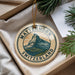 A circular ornament with the text "MATTERhorn SWITZERLAND" and an illustration of a mountain, hanging from a string.