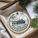 A decorative ornament with the text "Memphis, Tennessee, USA" printed on it, hanging from a string.