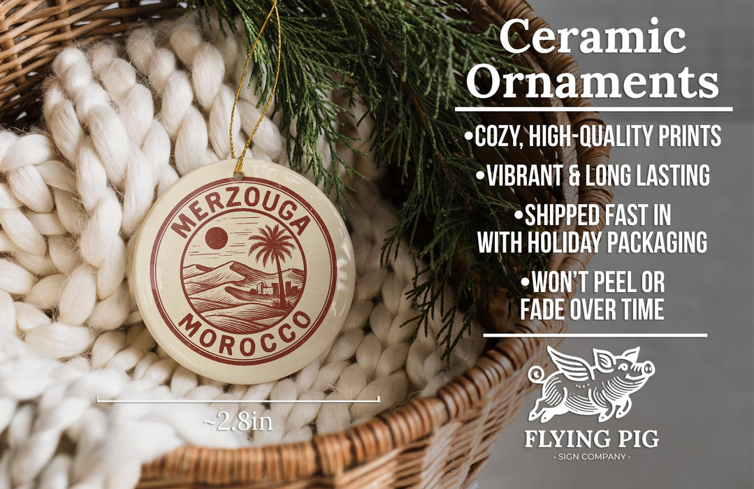 Ceramic ornaments, including a merzouga Morocco ornament, are displayed in a woven basket.