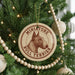A Christmas tree decorated with ornaments, including a circular ornament with a bull terrier image and the text "Miniature Bull Terrier".