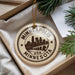 A circular ornament with the text "MINNEAPOLIS USA MINNESOTA" printed on it, hanging from a string.