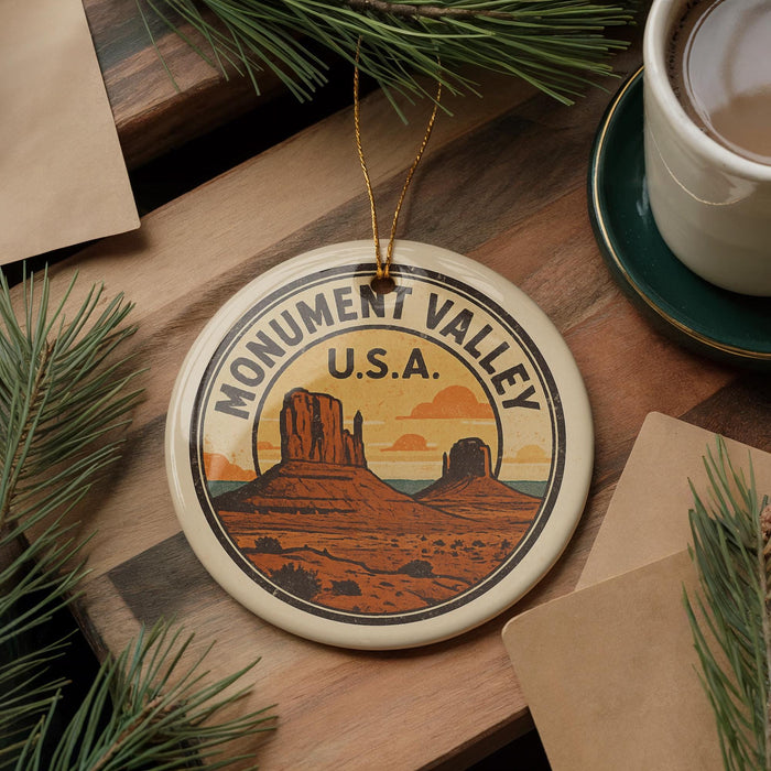 A circular ornament with the text "MONUMENT VALLEY U.S.A." and an illustration of Monument Valley, a famous landmark in the United States.