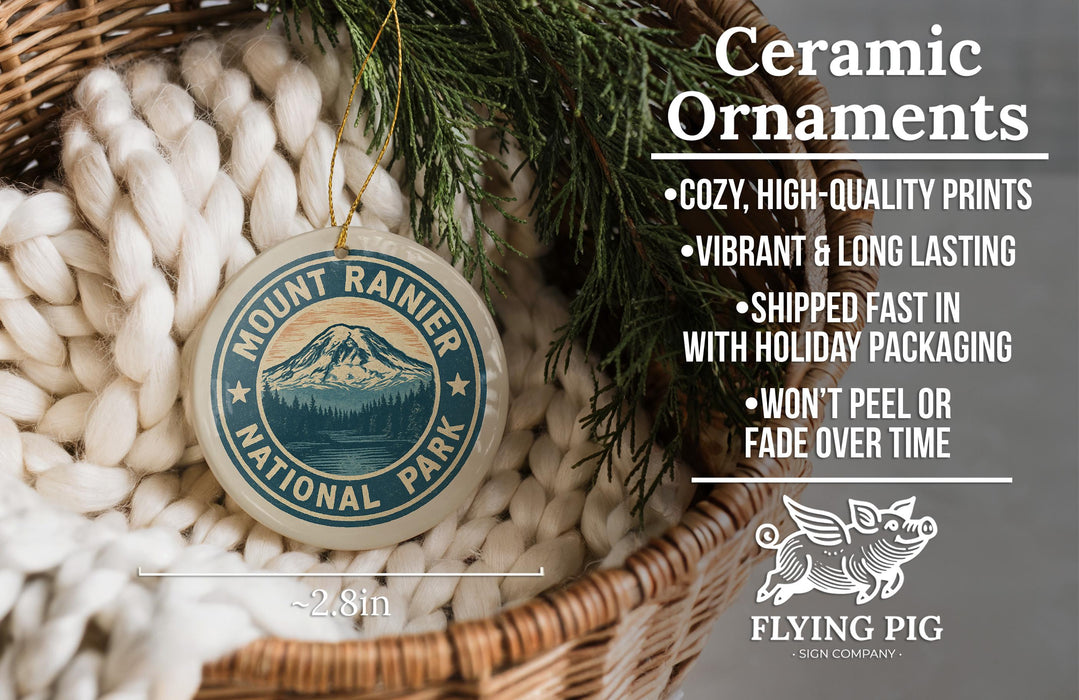 a ceramic ornament with a mountain landscape design, hanging from a wicker basket. The ornament is described as a "Ceramic Ornaments" and is made of "Cozy, High-quality Prints" and "Vibrant & Long Lasting". It is also noted that the ornament is "Shipped Fast in with Holiday Packaging" and " Won't Peel or Fade Over Time". The image is a part of a larger collection of images, and the caption is a brief description of the image without any redun