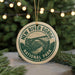 A circular ornament with the text "NEW RIVER GORGE NATIONAL PARK USA" and an illustration of a bridge in the background, hanging from a string.