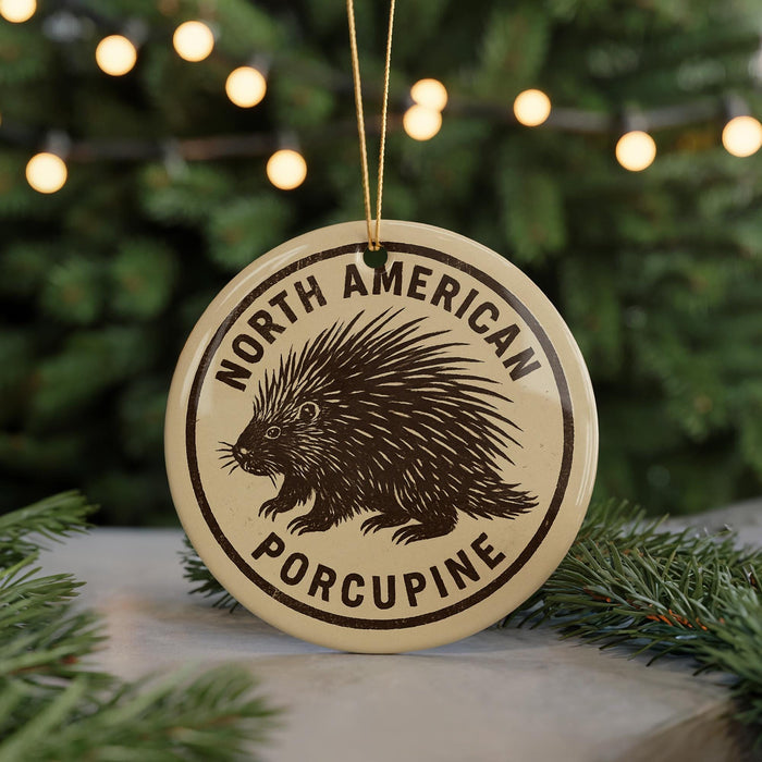 A round ornament with the text "NORTH AMERICAN PORCUPINE" and a graphic of a porcupine.