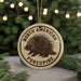 A round ornament with the text "NORTH AMERICAN PORCUPINE" and a graphic of a porcupine.
