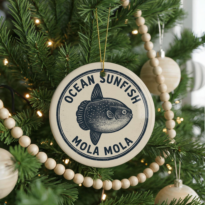 A Christmas tree decorated with ornaments, including a circular ornament with a fish design and the text "OCEAN SUNFISH MOLA MOLA".