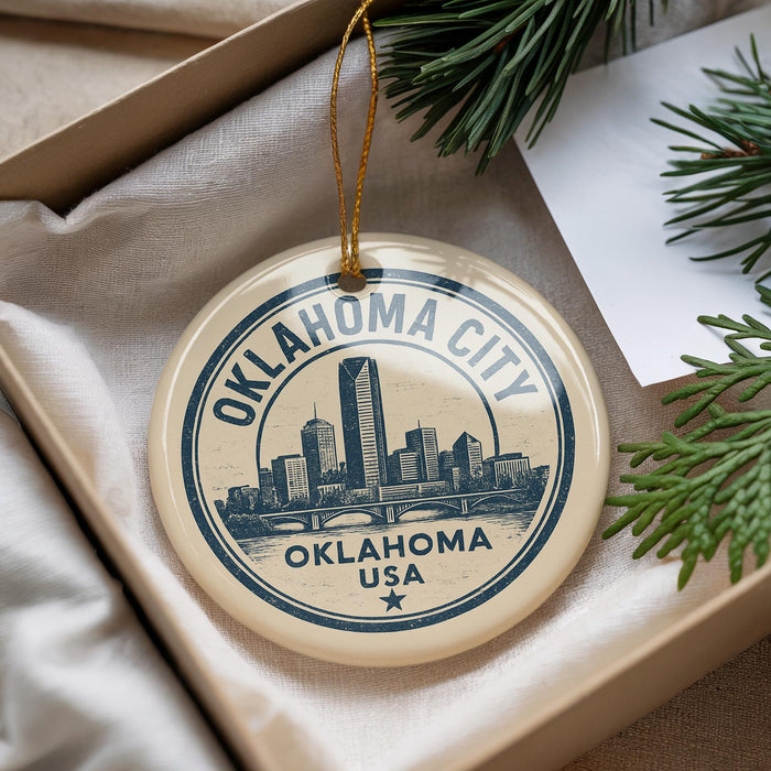 A circular ornament with the text "OKLAHOMA CITY USA" and an illustration of a city skyline, hanging from a string.