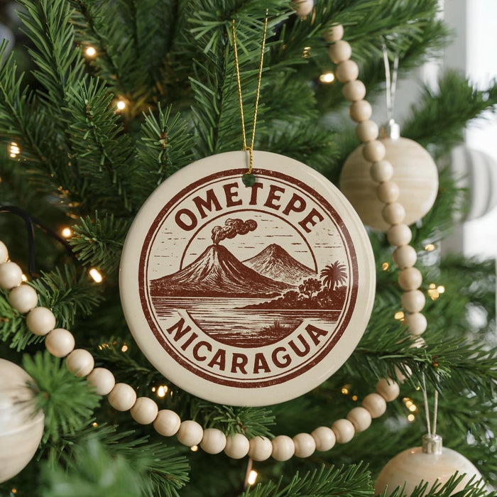 A Christmas tree decorated with ornaments, including a circular ornament with the text "OMETOPE" and "NICARAGUA" printed on it.