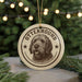 A round ornament with a dog's head and the word "OTTERHOUND" printed on it, hanging from a string.