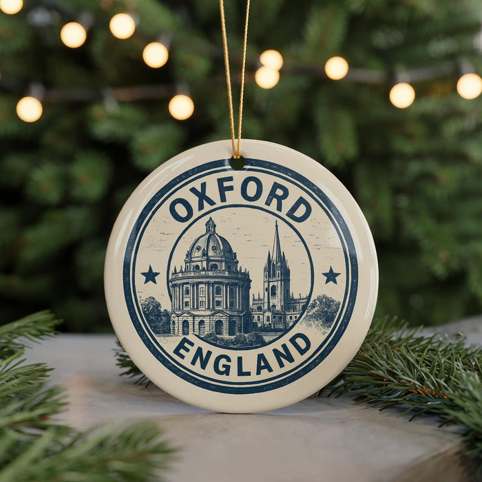 A circular ornament with the text "OXFORD ENGLAND" and an illustration of a building, likely representing Oxford, England.