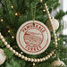 A Christmas tree decorated with ornaments, including a circular ornament with the text "PAMUKKALE TURKEY" and a beaded ornament.