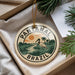 A circular ornament with the text "PANTANAL BRASIL" and an illustration of a bird standing in a tropical landscape.