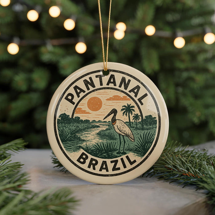 A circular ornament with the text "PANTANAL BRASIL" and an illustration of a bird standing on a palm tree, surrounded by a tropical landscape.