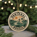 A circular ornament with the text "PANTANAL BRASIL" and an illustration of a bird standing on a palm tree, surrounded by a tropical landscape.