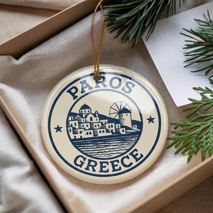 A circular ornament with the text "PAROS GRECE" and an illustration of a Greek island, hanging from a string.