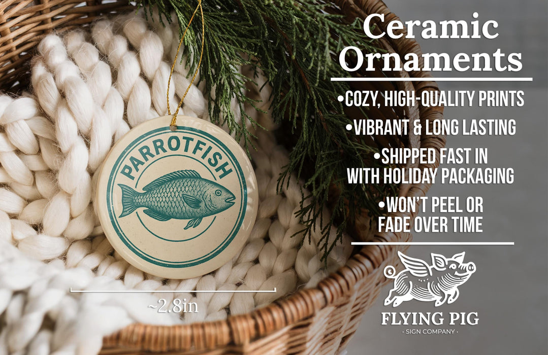 Ceramic ornaments, featuring a parrotfish design, are displayed in a woven basket.