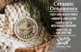 Ceramic ornaments, featuring a round ornament with a palm tree and the text "PEMBA ISLAND TANZANIA" and a wicker basket with greenery.