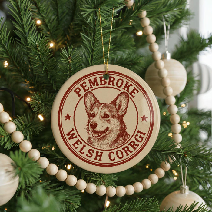 A Christmas tree decorated with ornaments, including a circular ornament with a Welsh Corgi image and the text "Pembroke Welsh Corgi".
