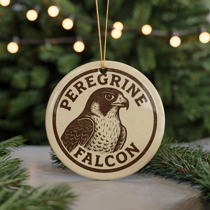 A round ornament with the text "Peregrine Falcon" and an illustration of a peregrine falcon.