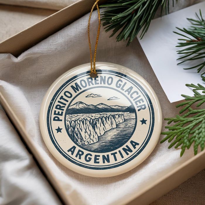 A circular ornament with the text "PERITO MORENO GLACIER ARGENTINA" printed on it, hanging from a string.
