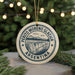 A circular ornament with the text "PERITO MORENO GLACIER ARGENTINA" printed on it, surrounded by pine branches and lights.