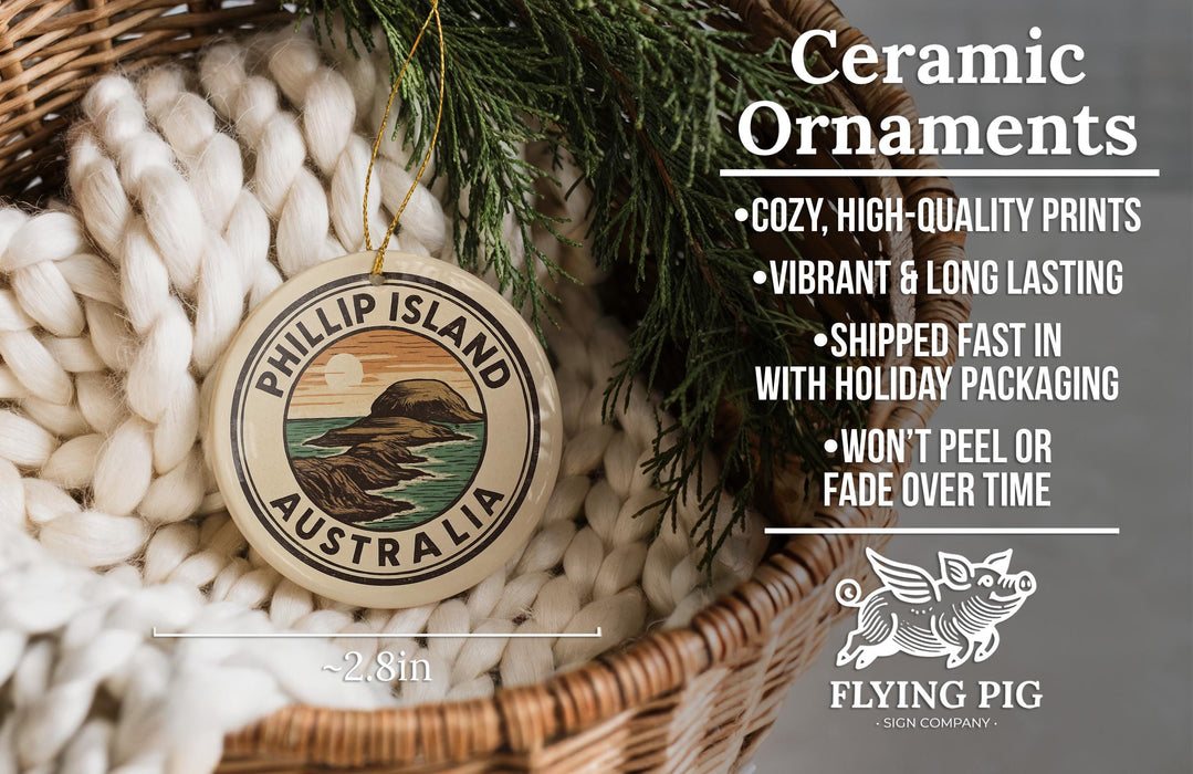 Ceramic ornaments, including a round ornament with a design of a mountain and ocean, are displayed in a woven basket.
